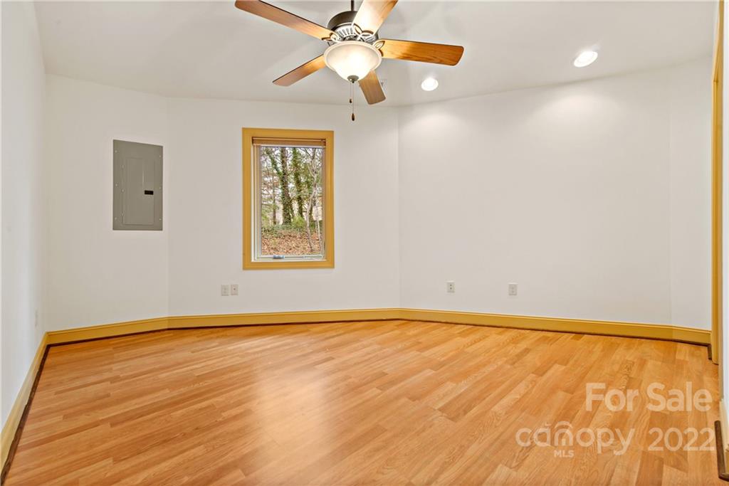 174 A Weston Road Arden, NC 28704 - Photo 27 of 31 wooden floor in an empty room with a window