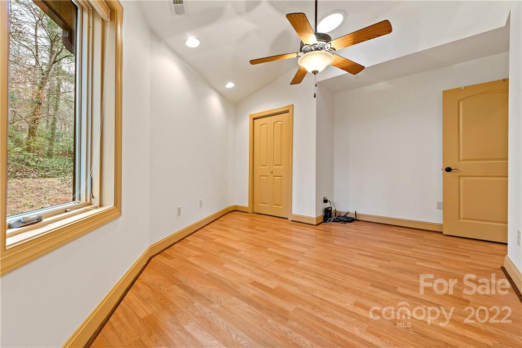 174 A Weston Road Arden, NC 28704 - Photo 28 of 31 a view of an empty room with a window
