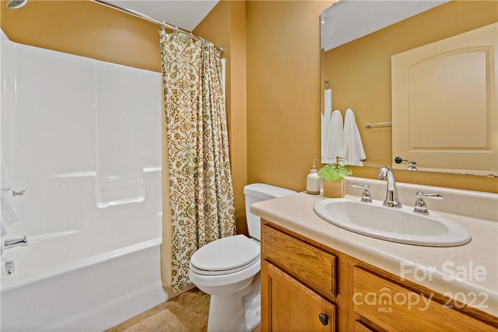 174 A Weston Road Arden, NC 28704 - Photo 29 of 31 a bathroom with a sink a toilet and shower