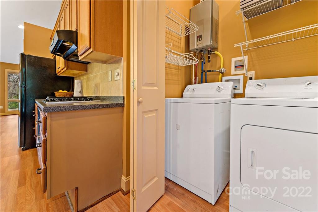 174 A Weston Road Arden, NC 28704 - Photo 30 of 31 a utility room with dryer and washer