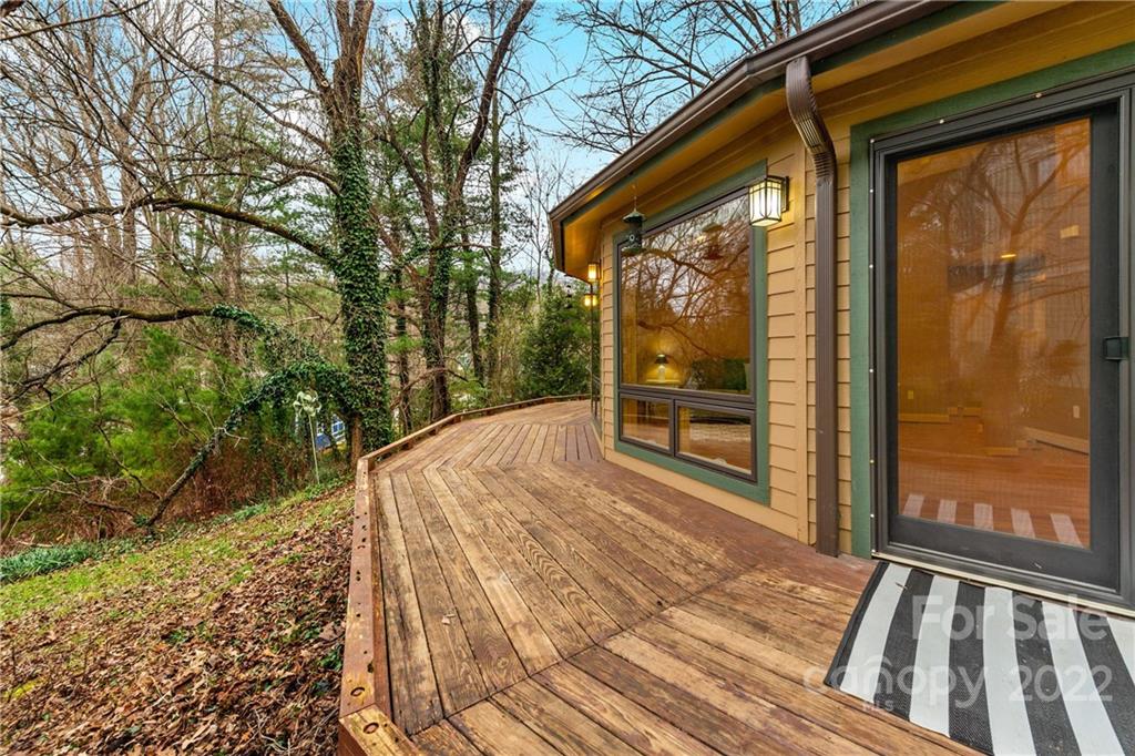 174 A Weston Road Arden, NC 28704 - Photo 5 of 31 a view of a backyard with a large tree