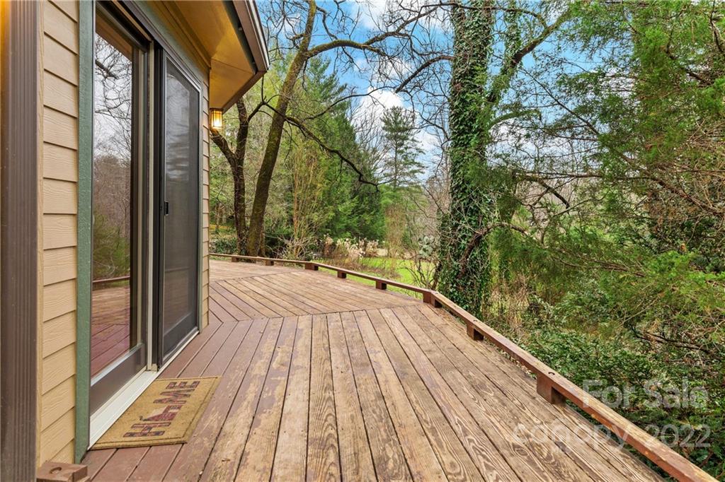 174 A Weston Road Arden, NC 28704 - Photo 6 of 31 a view of balcony with wooden floor and fence
