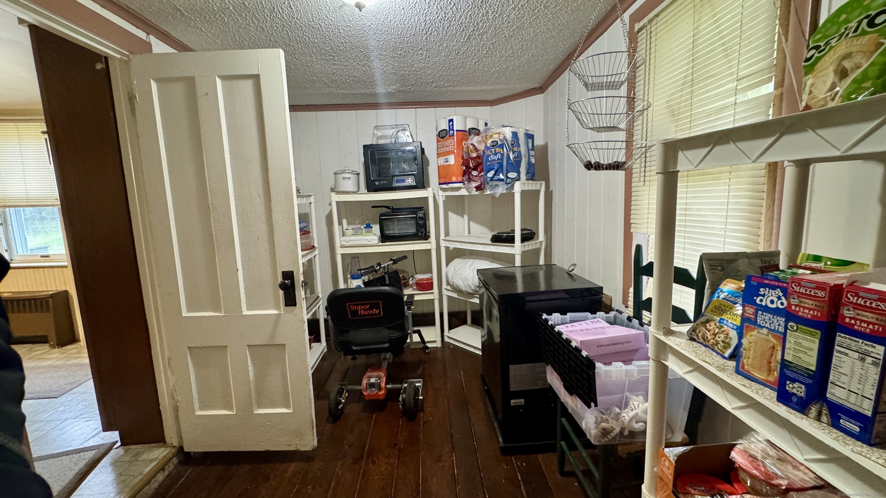 462 Norwich Road Plainfield, CT 06374 - Photo 11 of 23 a view of a livingroom with furniture hardwood floor and windows
