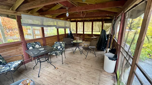 a view of a wooden door of the house