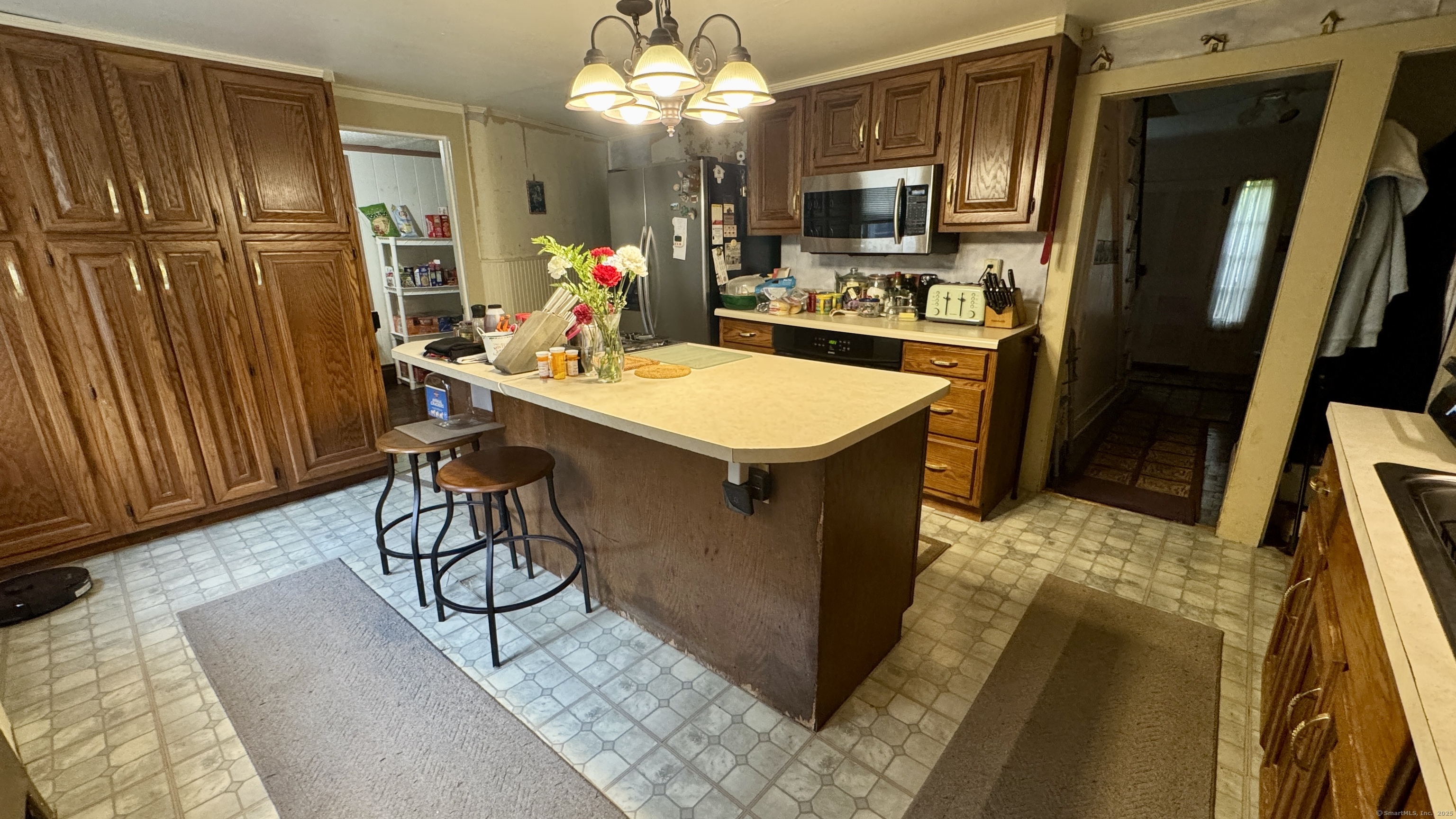 462 Norwich Road Plainfield, CT 06374 - Photo 2 of 23 a kitchen with stainless steel appliances granite countertop a refrigerator a sink a stove and island