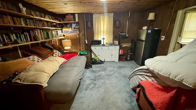 a living room with lots of furniture and closet