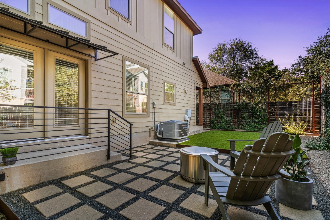 a view of a chairs and table in the patio