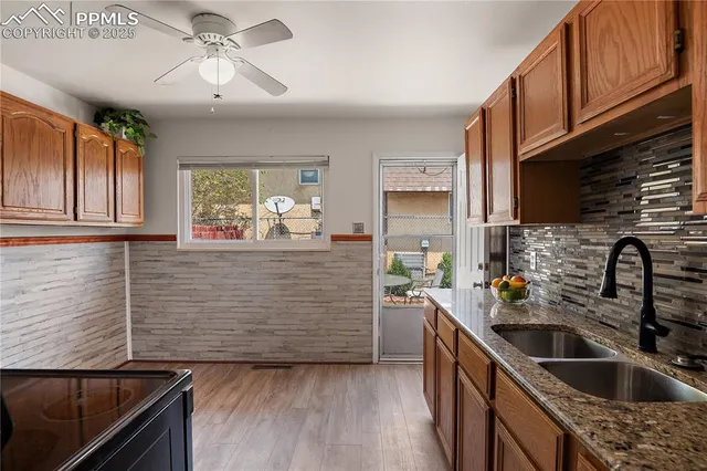 a kitchen with sink cabinets and window