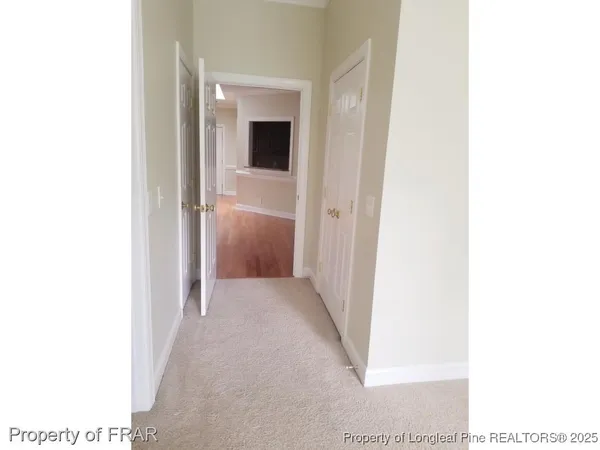 a view of a hallway with a white walls