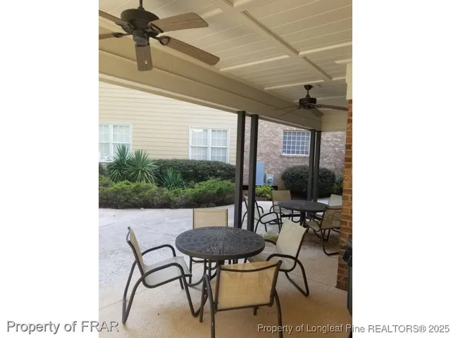a view of a room with table and chairs