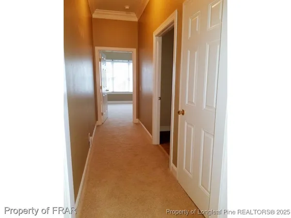 a view of a hallway with a white walls