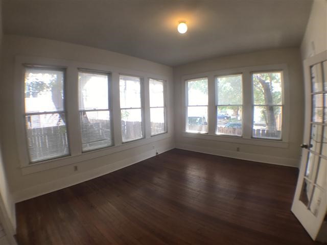2307 Rio Grande Street, Unit B Austin, TX 78705 - Photo 2 of 2 a view of an empty room with wooden floor and a window
