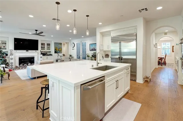 a living room with furniture fireplace and flat screen tv