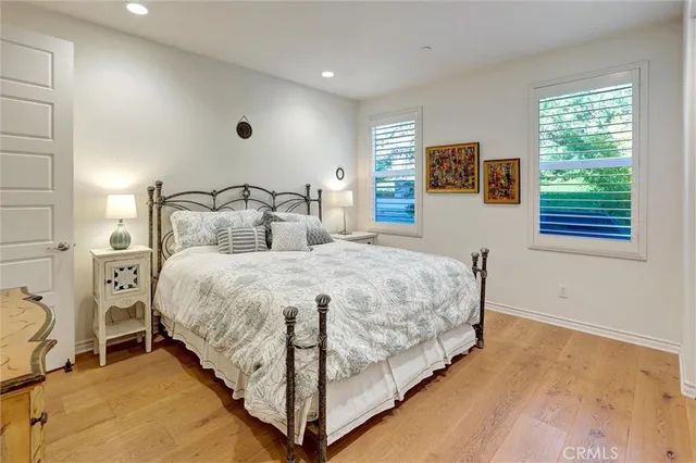 a large en suite bathroom with sink and mirror