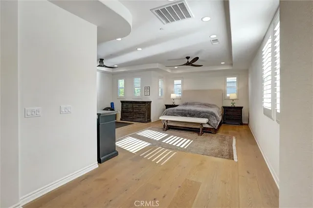 a work room with furniture and a flat screen tv