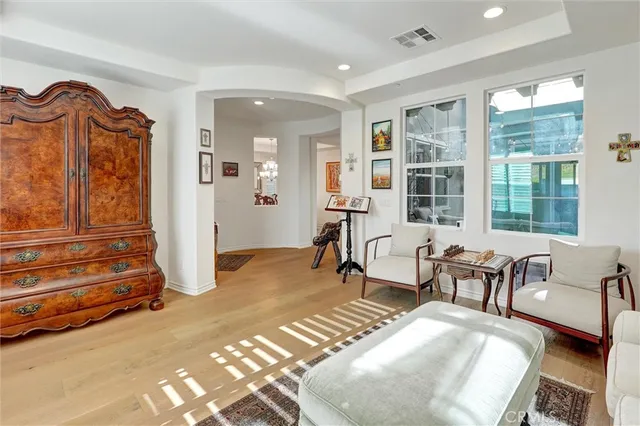 a view of a dining room with furniture and chandelier