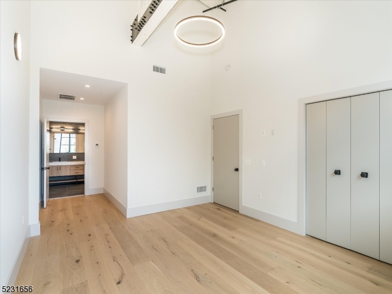 369 Bloomfield Avenue, Unit 2 Montclair, NJ 07042 - Photo 13 of 19 wooden floor in an empty room