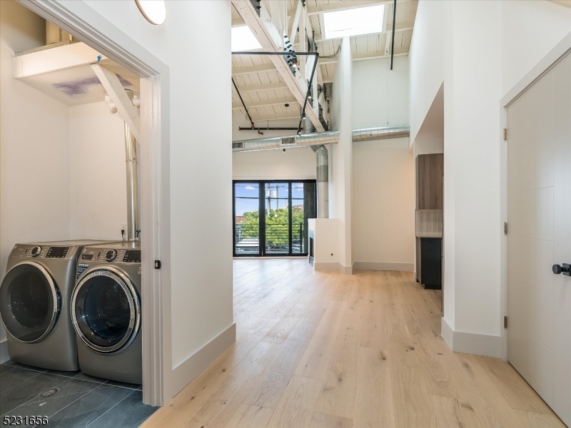 369 Bloomfield Avenue, Unit 2 Montclair, NJ 07042 - Photo 2 of 19 a view of a hallway with washer and dryer