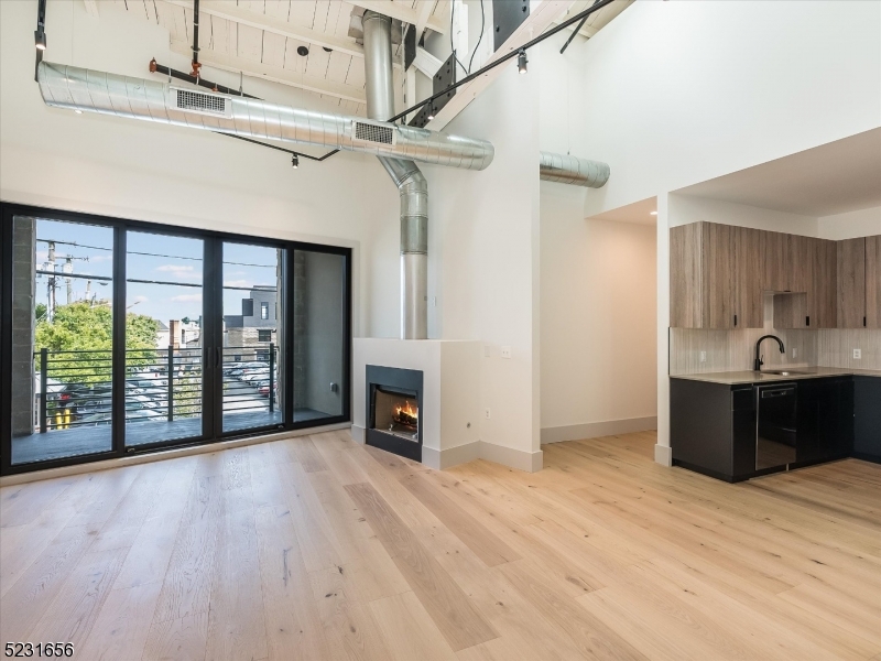 369 Bloomfield Avenue, Unit 2 Montclair, NJ 07042 - Photo 4 of 19 a view of a kitchen with a sink and a fireplace