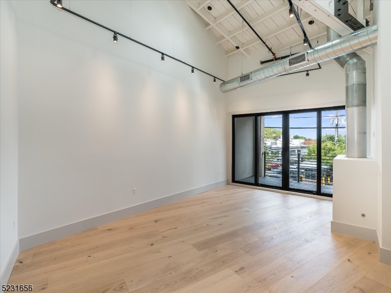 369 Bloomfield Avenue, Unit 2 Montclair, NJ 07042 - Photo 7 of 19 a view of an empty room with a window