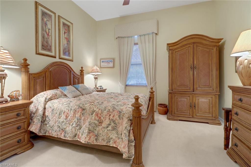 20531 Foxworth Circle Estero, FL 33928 - Photo 19 of 50 Bedroom with ceiling fan and light carpet