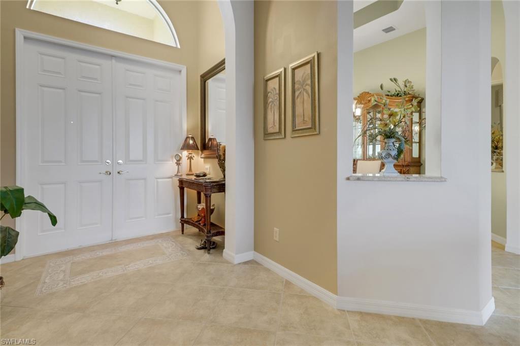 20531 Foxworth Circle Estero, FL 33928 - Photo 2 of 50 Foyer with light tile patterned floors