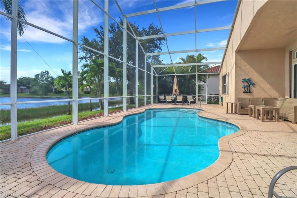 20531 Foxworth Circle Estero, FL 33928 - Photo 23 of 50 View of swimming pool featuring a lanai and a patio