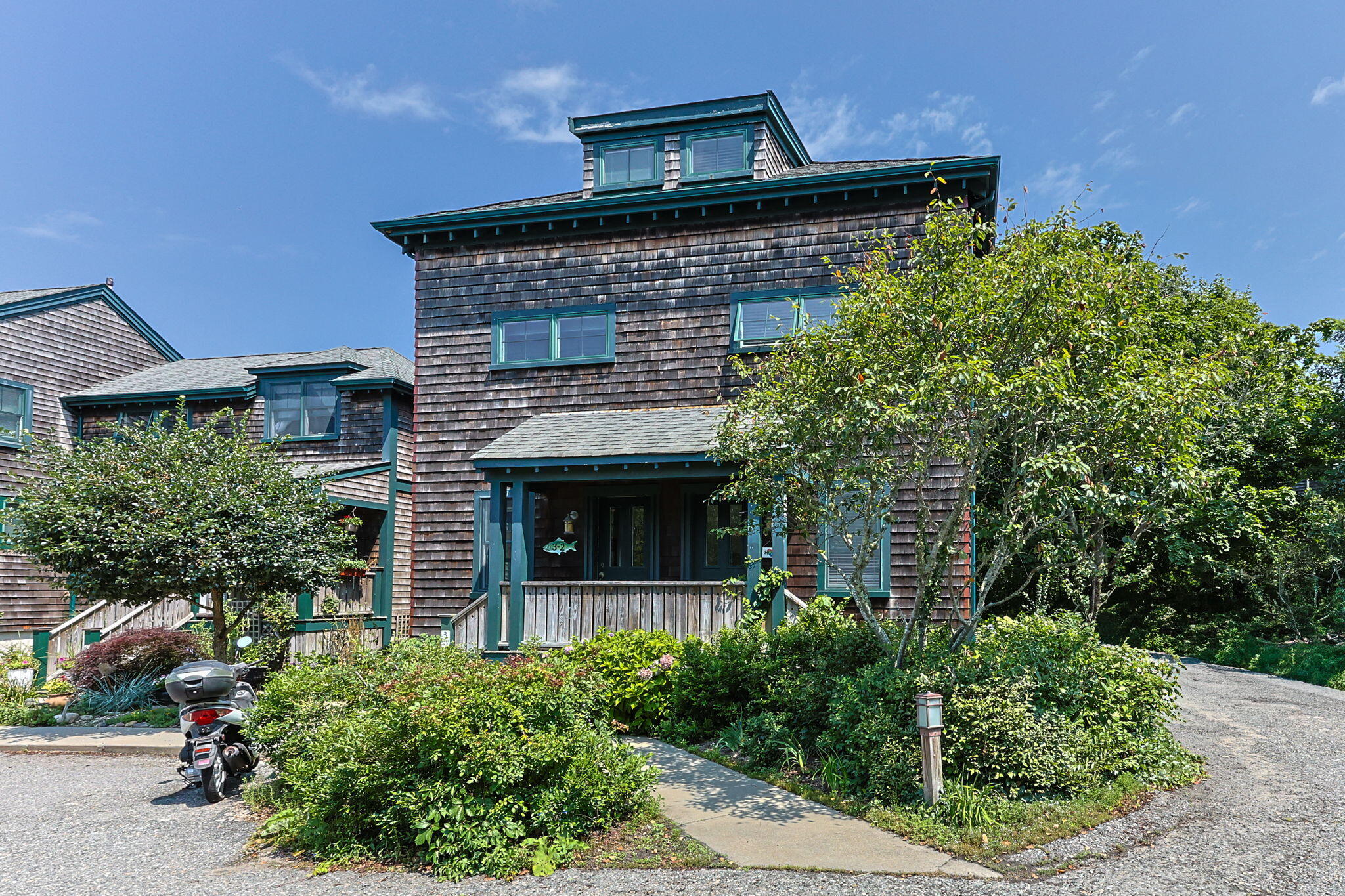 3 Meadow Road, Unit 2 Provincetown, MA 02657 - Photo 1 of 26 a front view of a house with plants