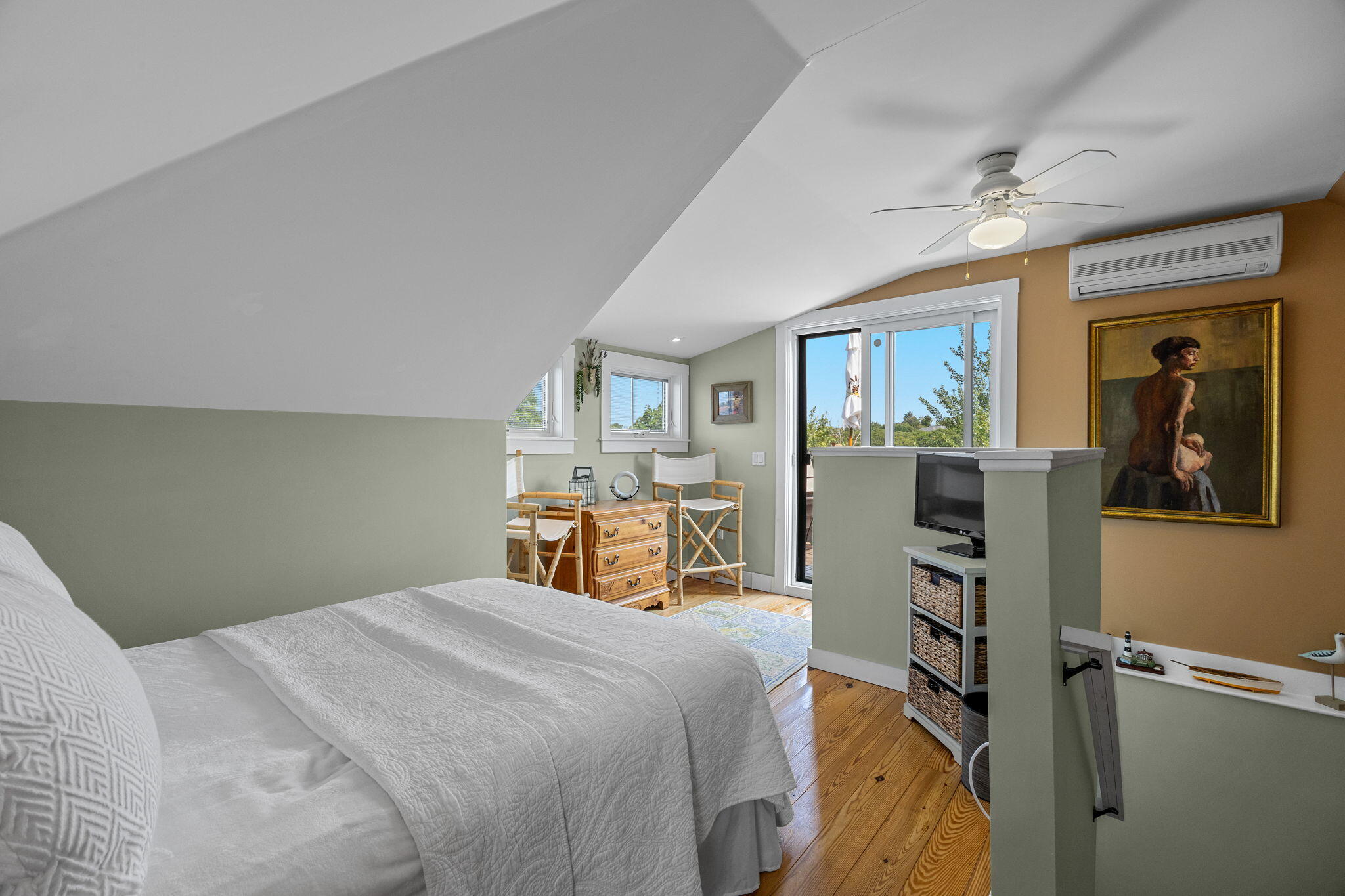 3 Meadow Road, Unit 2 Provincetown, MA 02657 - Photo 16 of 26 a bedroom with a large bed and a chandelier