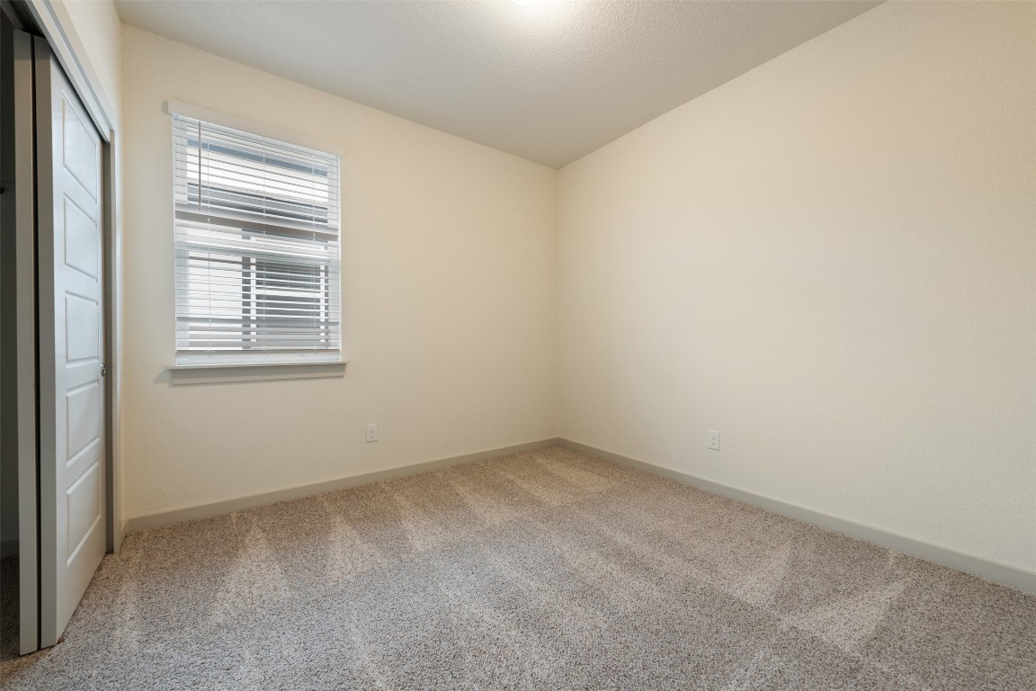 220 Deserti Road Leander, TX 78641 - Photo 11 of 16 Unfurnished room featuring carpet and baseboards