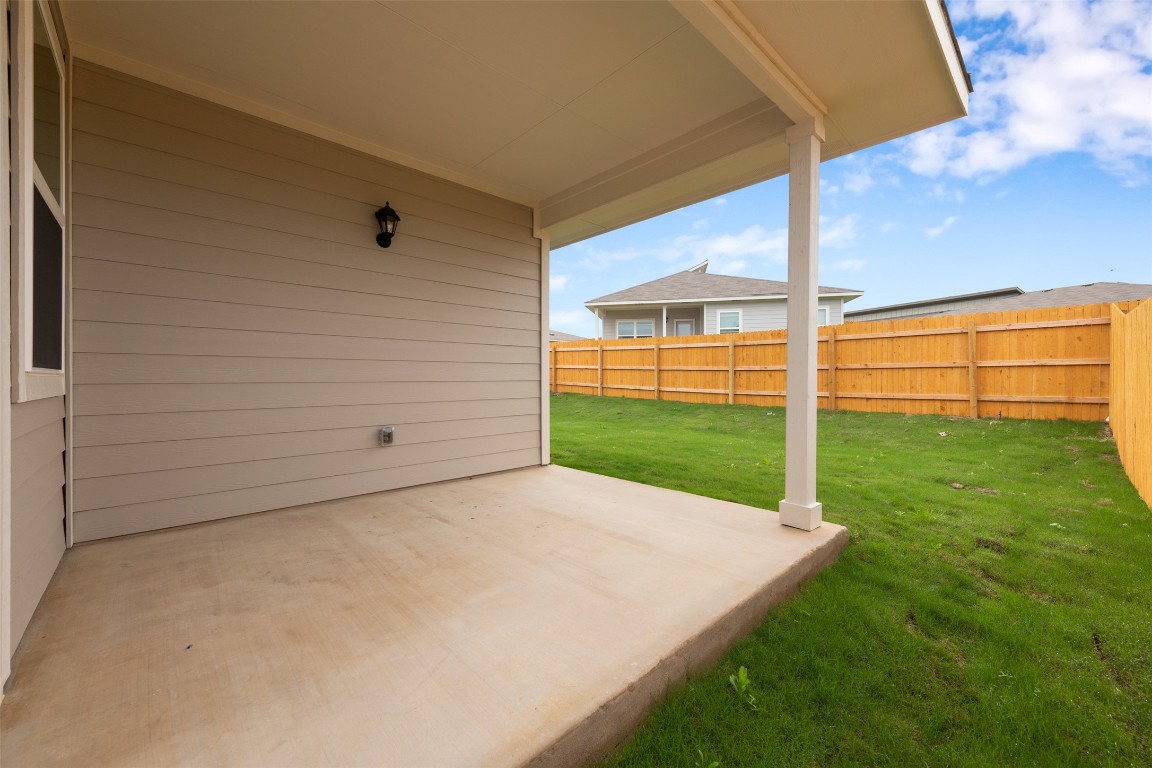 220 Deserti Road Leander, TX 78641 - Photo 15 of 16 Fenced backyard with a patio area