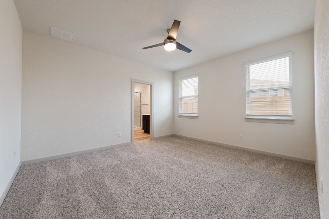 220 Deserti Road Leander, TX 78641 - Photo 9 of 16 Spare room featuring light colored carpet and ceiling fan