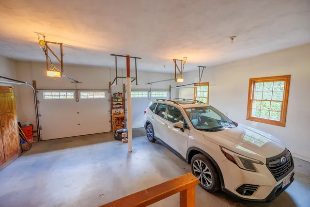 a bathroom with a sink mirror and toilet