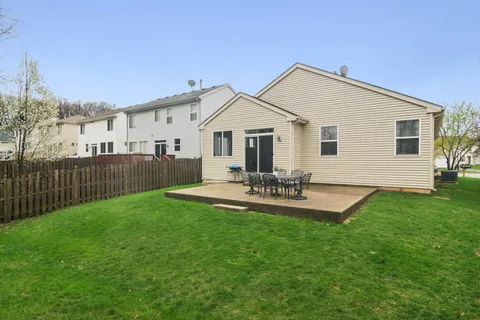 a view of a house with swimming pool and porch