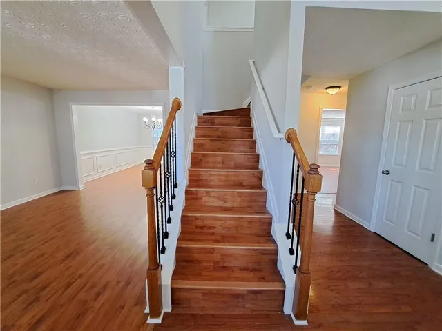 a view of entryway with wooden floor