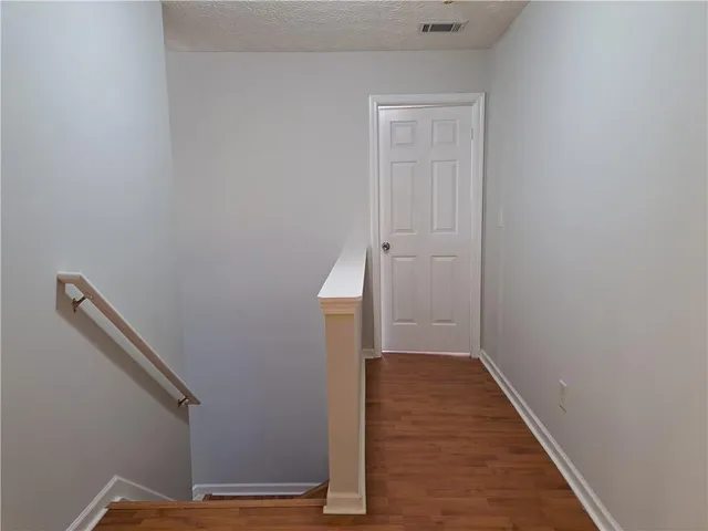 a view of a hallway with staircase