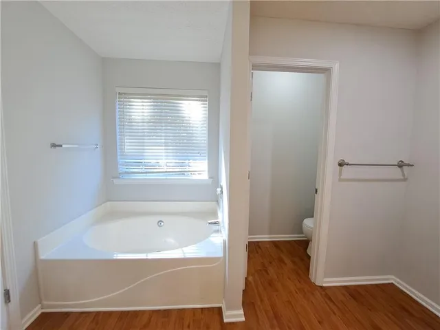 a bathroom with a bathtub and shower