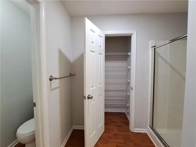 a view of bathroom with a toilet and a shower