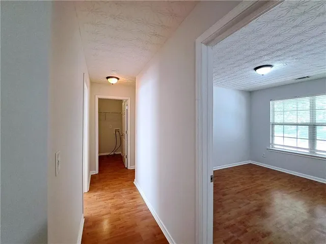 a view of hallway with windows