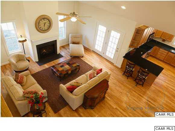0 Timber Ridge, Unit 2 Gordonsville, VA 22942 - Photo 15 of 19 a living room with furniture a fireplace a rug and a window