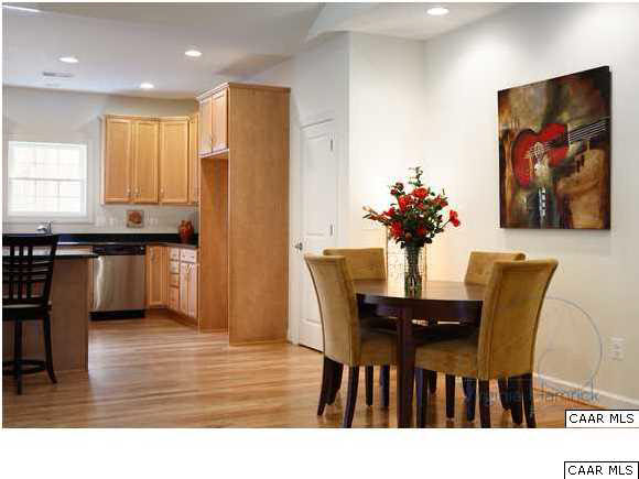 0 Timber Ridge, Unit 2 Gordonsville, VA 22942 - Photo 16 of 19 a view of a dining room with furniture and wooden floor