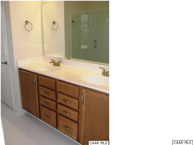 0 Timber Ridge, Unit 2 Gordonsville, VA 22942 - Photo 18 of 19 a bathroom with a double vanity sink and mirror
