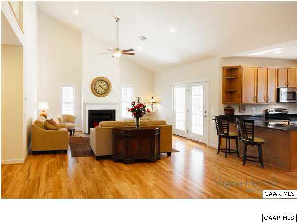 0 Timber Ridge, Unit 2 Gordonsville, VA 22942 - Photo 8 of 19 a living room with furniture and a fireplace