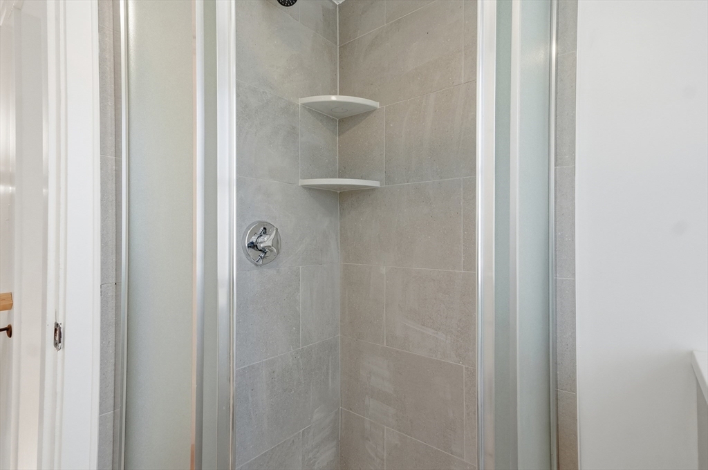 29 Puritan Road Watertown, MA 02472 - Photo 15 of 33 a bathroom with a shower
