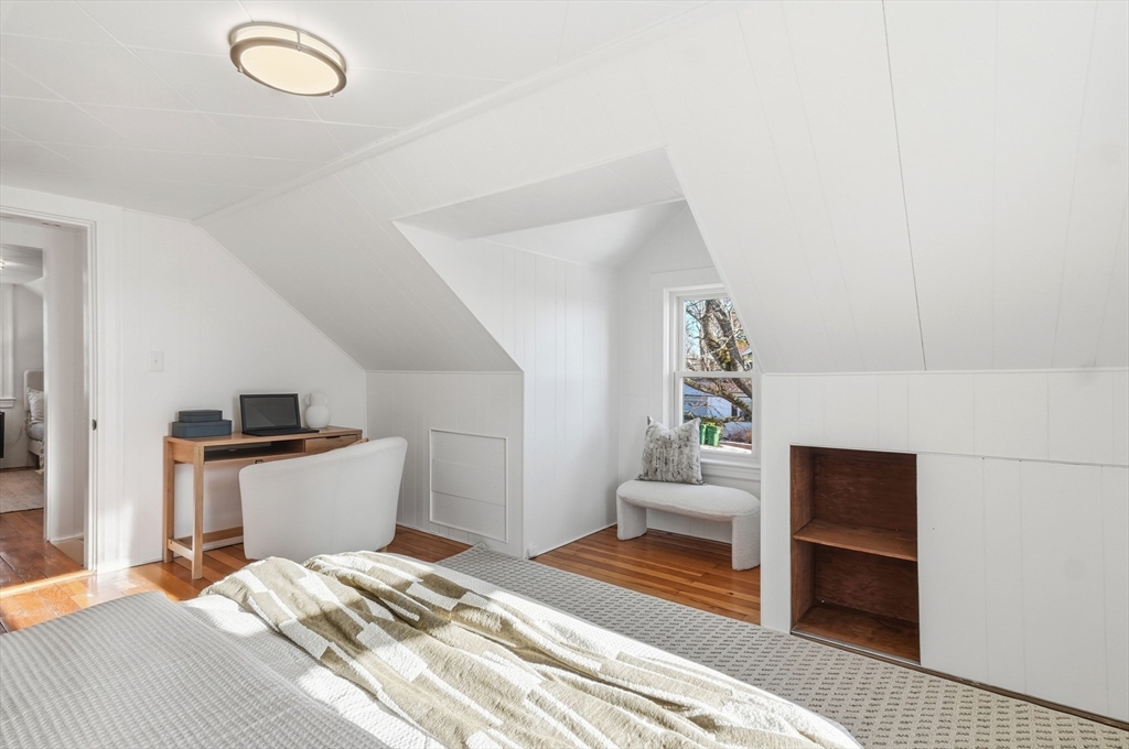 29 Puritan Road Watertown, MA 02472 - Photo 16 of 33 a bedroom with a bed and a chair