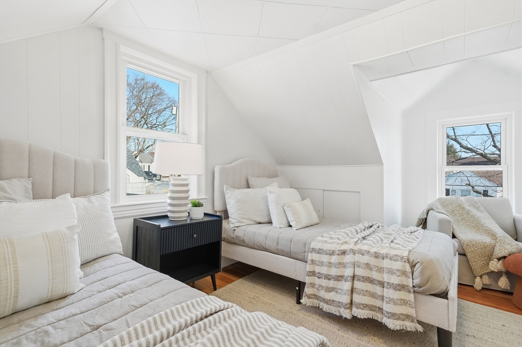 29 Puritan Road Watertown, MA 02472 - Photo 19 of 33 a bedroom with a bed and a table