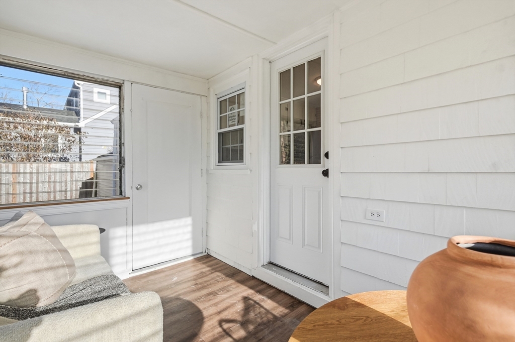 29 Puritan Road Watertown, MA 02472 - Photo 26 of 33 a living room with a couch and a large window