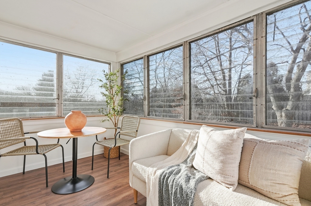 29 Puritan Road Watertown, MA 02472 - Photo 27 of 33 a living room with furniture and a floor to ceiling window