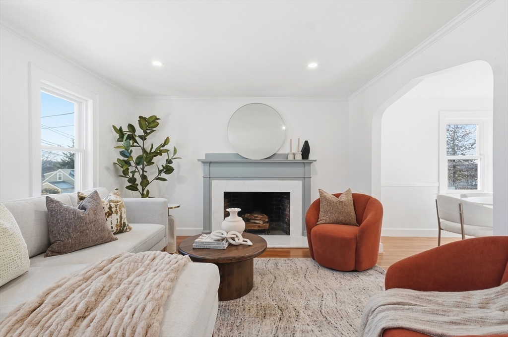 29 Puritan Road Watertown, MA 02472 - Photo 3 of 33 a living room with furniture and a fireplace