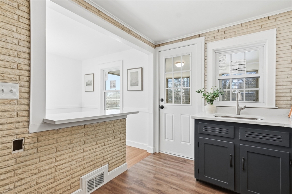 29 Puritan Road Watertown, MA 02472 - Photo 8 of 33 a bathroom with a sink and a mirror